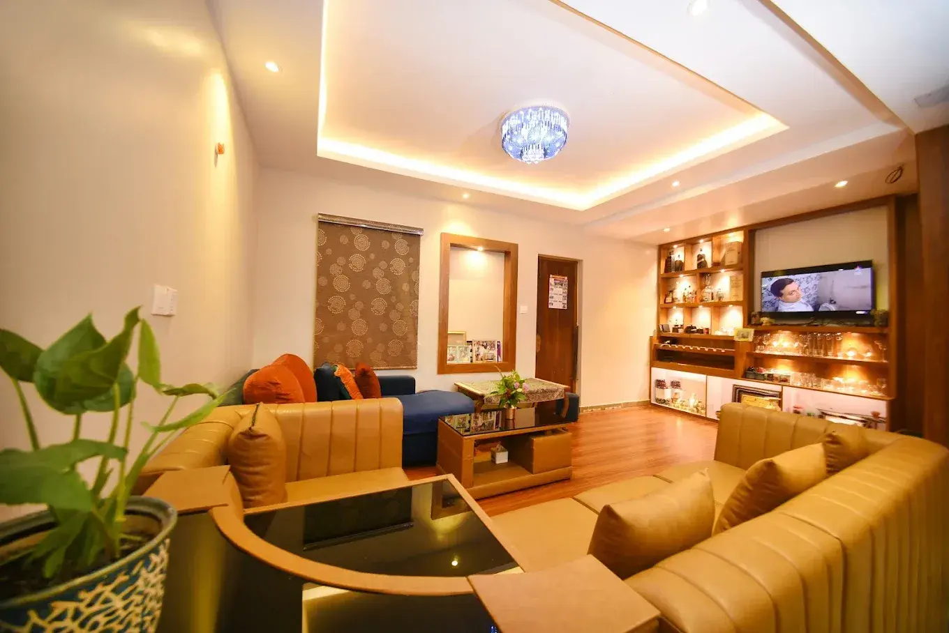 Warm shared lounge with sofas and family details